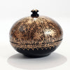 Black and gold round jewelry and trinket box with handled lid