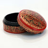 Red and black round paper mache box