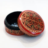 Red and black round paper mache box